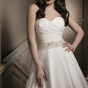 Stunning Ivory Justin Alexander Bridal Gown Embellished with Beading and Pearls.